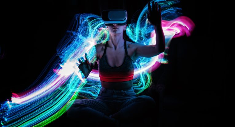 Metaverse digital Avatar, Metaverse Presence, digital technology, cyber world, virtual reality, futuristic lifestyle. Woman in VR glasses playing AR augmented reality NFT game with neon blur lines.