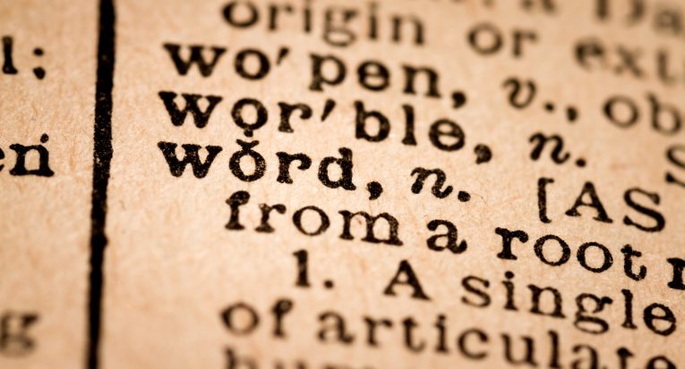 October 1st, 2015 - Montreal, Canada. Close-up of an Old 1945 Webster Vintage Dictionary showing the Word WORD
