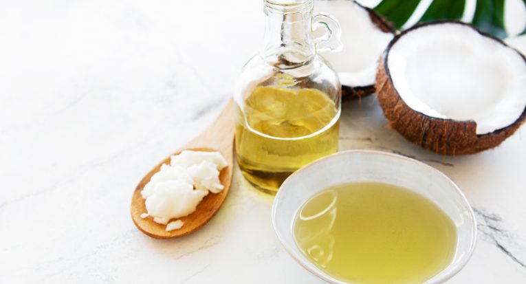 Coconut natural spa ingredients on a white marble background