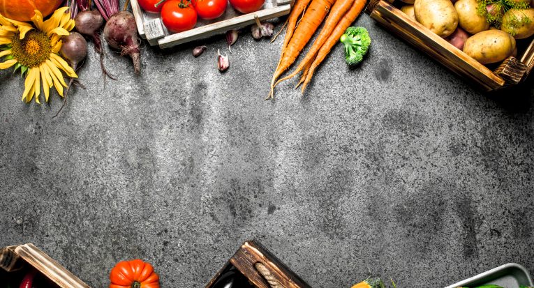 Organic food. Harvested vegetables. On a rustic background