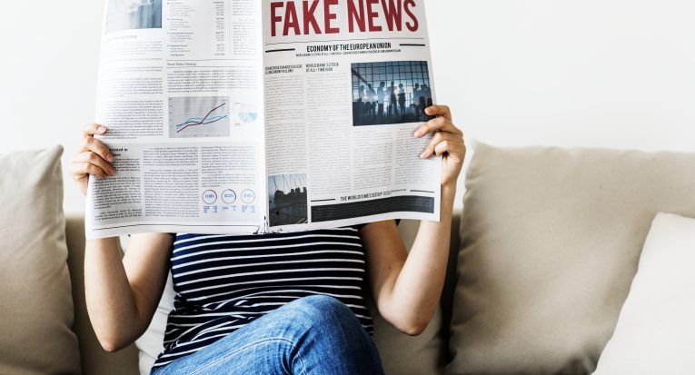 Woman reading newspaper